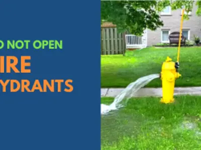 Picture of fire hydrant with water pouring out and text that reads "do not open fire hydrants"
