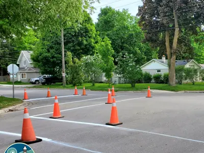 Picture of lines being painted on roadway