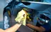 a picture of a person waxing a car