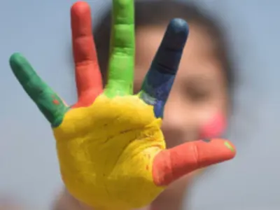Child with painted hand