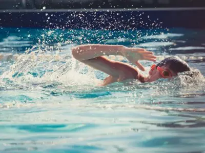 Child swimming in pool