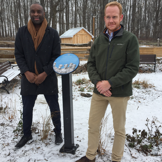 Mayor Wade Mills and Deputy Mayor Steve Anderson standing beside memorial plaque for the No2 Black Battalion