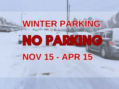 Snow covered road with cars on road blocked