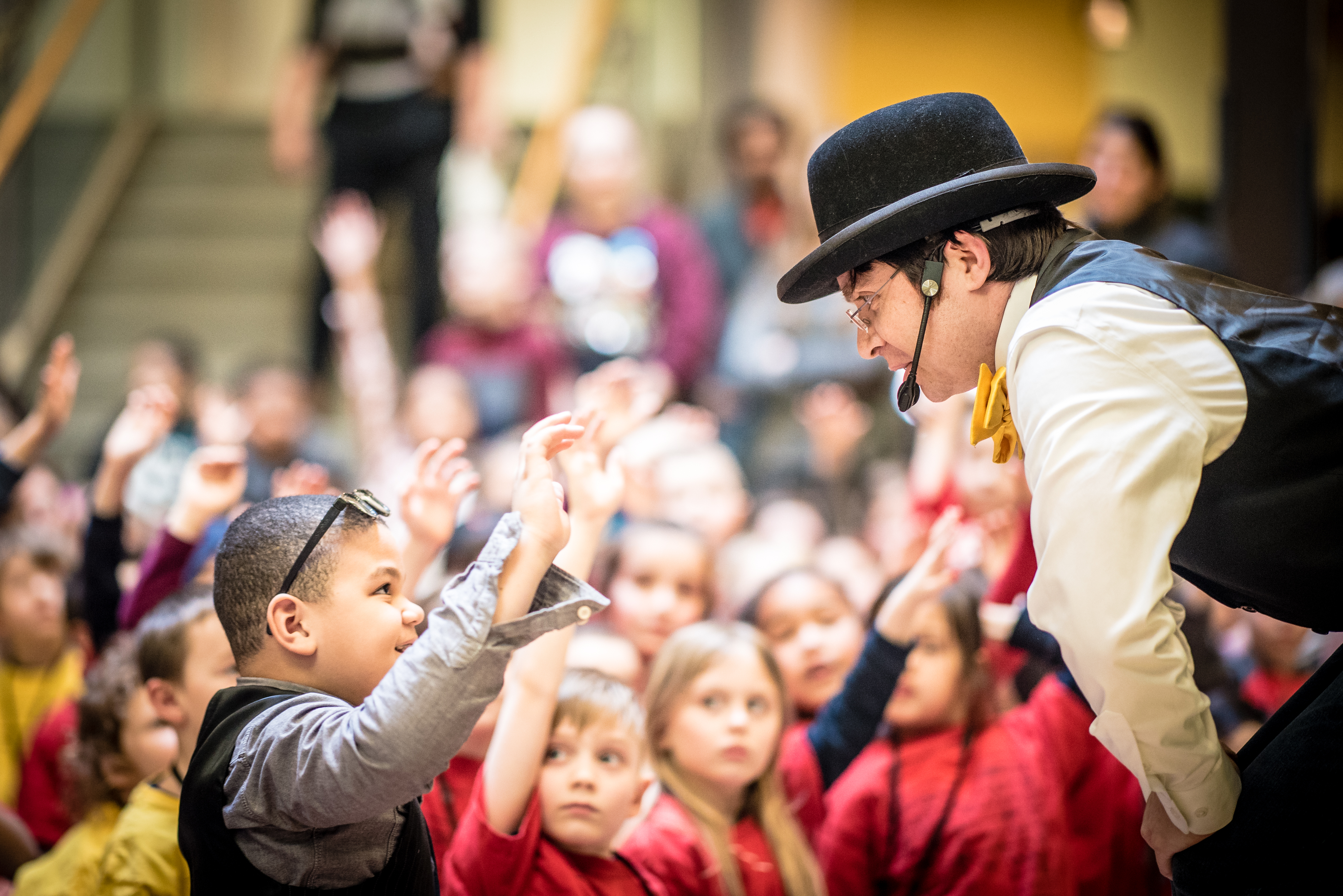 Drew Ripley Balloon artist standing on a cannon firing balloons made to look like smoke
