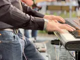 Campfire Poet playing keyboard